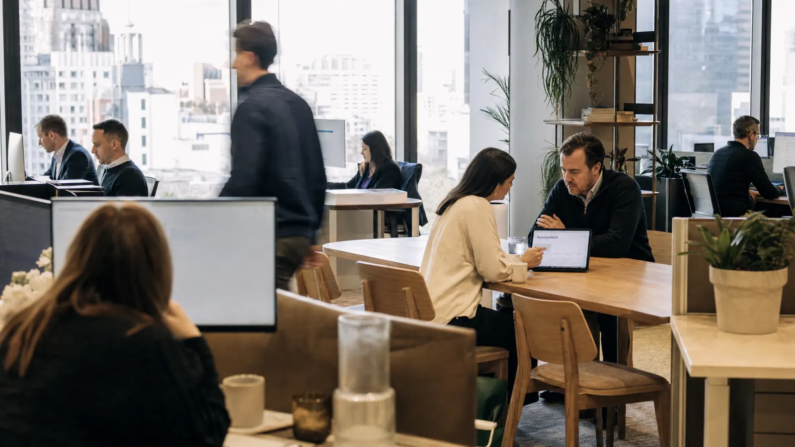 Advice teams at work across an open-plan office